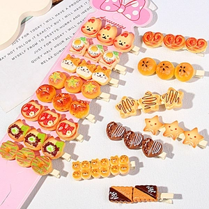 Detailed close-up of cute 3D resin food and animal hair clips on pink display cards