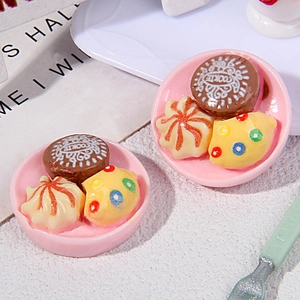 Macro shot of miniature Chinese breakfast pastries on pink trays for dollhouse decor