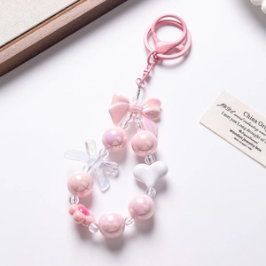 Pink and white beaded keychain with heart charms and bow for phones and bags