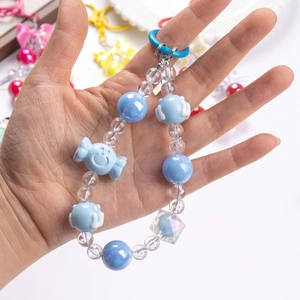 Handmade blue candy-shaped beaded phone charm with gradient beads and cloud accents