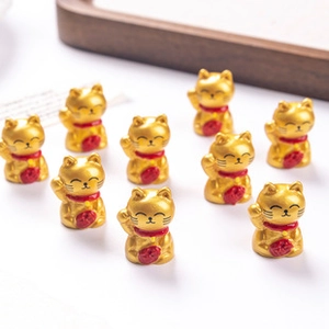 Set of ten golden resin lucky cat charms for DIY crafts and decorative accessories