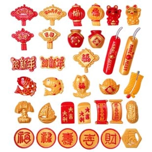 Flat lay of Chinese New Year resin charms including lucky cats and koi fish decorations
