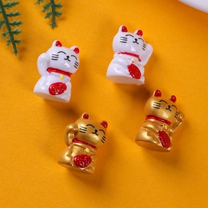 Miniature resin lucky cat figurines in white and gold for garden and desk decor