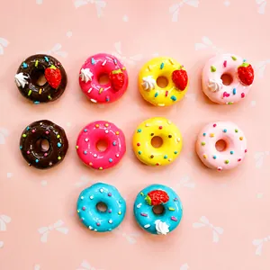 Macro shot of assorted colorful resin donut charms for DIY crafts and accessories