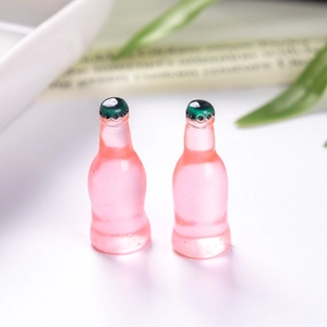 Set of two miniature pink resin soda bottles for DIY dollhouse and food play crafts