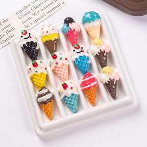 Set of 12 colorful resin ice cream cone charms for DIY crafts on a white ceramic tray