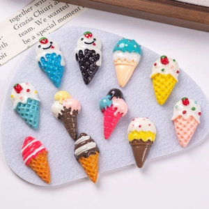 Flat lay of colorful resin ice cream cone charms for DIY crafts and accessories