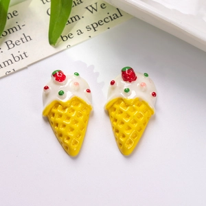 Detailed view of resin ice cream cones with strawberry and sprinkles for DIY crafts