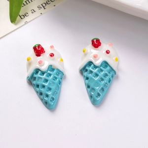 Macro detail of resin ice cream charms with blue waffle cones and strawberry toppings