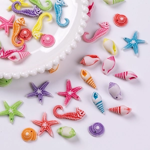 Detailed close-up of acrylic ocean animal beads including starfish and seahorse for DIY jewelry
