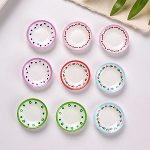Set of 9 miniature resin plates with various colorful patterns for dollhouse decor