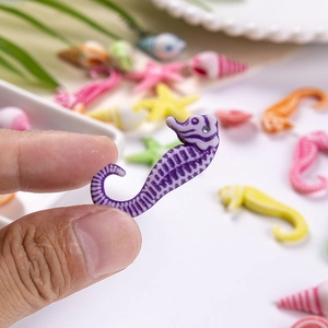 DIY colorful acrylic ocean beads featuring seahorse starfish and seashell shapes