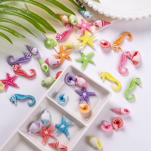 Detailed view of colorful acrylic ocean beads including seahorses and starfish for DIY crafts