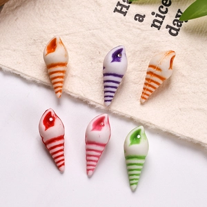 Macro shot of colorful acrylic shell charms with textured details for DIY jewelry making