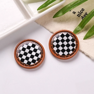 Detail of miniature resin checkerboard plates with Good Life text for DIY dollhouse crafts