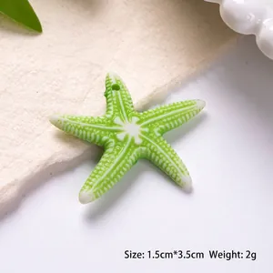 Detail of green acrylic starfish pendant measuring 1.5cm by 3.5cm for DIY jewelry making