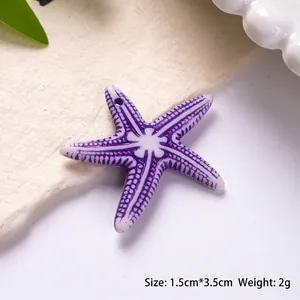 Detail of purple acrylic starfish charm with white spots for DIY jewelry making