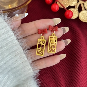 Pendientes de Año Nuevo con lazos rojos y colgantes dorados de la suerte para mujer