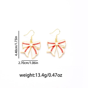 Close-up of bow-shaped baseball earrings with red stitching and golden hook details