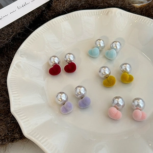 Detail of colorful flocked heart and pearl earrings in five sweet autumn pastel colors