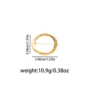 Détails de la broche dorée avec dimensions 3,5 cm par 3,9 cm et informations de poids