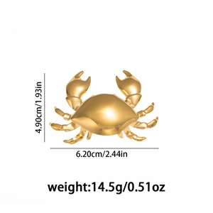 Detailed macro view showing the precise dimensions of a gold crab brooch jewelry piece
