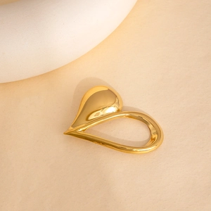 Polished gold hollow heart-shaped stainless steel brooch with minimalist metallic finish