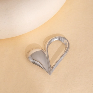 Polished hollow heart stainless steel brooch with a glossy silver mirror finish