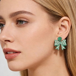St. Patrick's Day green clover print bow earrings with sparkling top for festive women