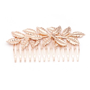 Detailed view of the intricate leaf veins on the golden metal alloy hair comb accessory