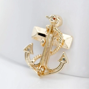 Golden anchor brooch with crystals and rope detail showing the secure back pin closure