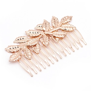 Elegant gold metal leaf hair comb accessory featuring detailed vintage leaf textures