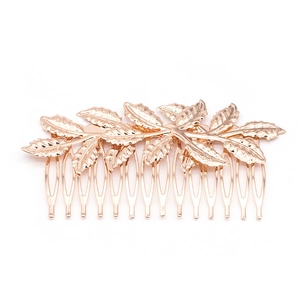 Elegant gold leaf hair comb accessory with detailed veins for weddings and festive events