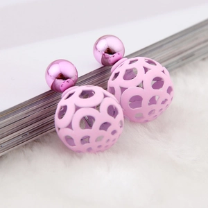 Minimalist pink and purple hollow sphere stud earrings set on a soft white background