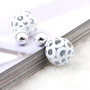 Detailed view of elegant double-sided stud earrings with hollow white ball design