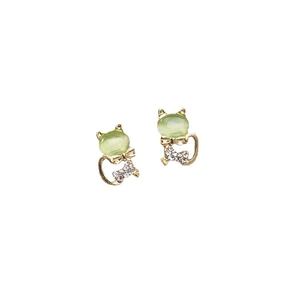 Cat-shaped opal earrings in gold plating with crystal bow accents on a white background