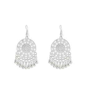 Detail view of ethnic silver hollow earrings with polished teardrop-shaped pendants