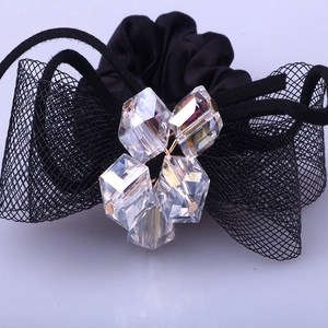Elegant black lace bow hair tie featuring sparkling crystals and knotted ribbon design