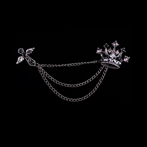 Silver crown and winged cross brooch with hanging chains and sparkling rhinestones