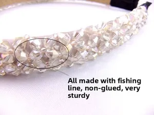 Detailed macro view of crystal beads hand-strung with fishing line on a satin headband