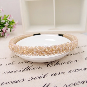 Detail of handmade champagne crystal beaded headband with satin lining and protective tips
