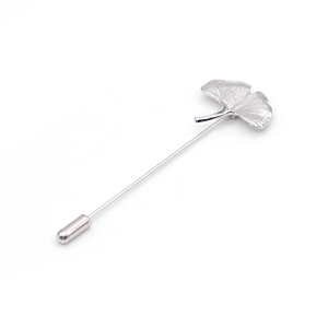 Silver ginkgo leaf brooch with fine radial texture and secure pin clasp for sweaters