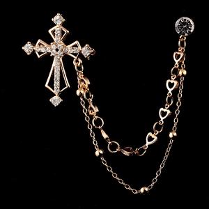 Goldene Vintage-Kreuzbrosche mit funkelnden Strasssteinen und feinen Doppeltasseln