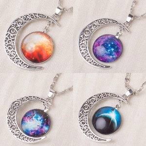 Starry sky and moon pendant necklaces in four distinct galaxy themed glass patterns