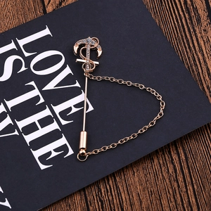 Retro rose gold anchor brooch with white rhinestones and metal chain on black card
