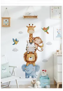 Nursery wall stickers featuring watercolor safari animals in a cozy bedroom setting
