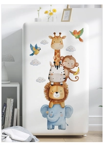 Detail of watercolor animal stickers featuring giraffe and lion on a white fridge