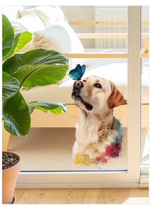 Detail of dog decal with blue butterfly on a glass sliding door in a bright living room