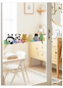 Detail of cute felt animal wall stickers featuring panda and tiger on a colorful base