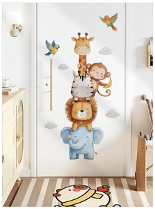 Detailed close-up of self-adhesive watercolor safari animals wall stickers on a white door